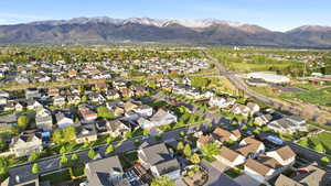 Aerial perspective of suburban area featuring a mountain backdrop