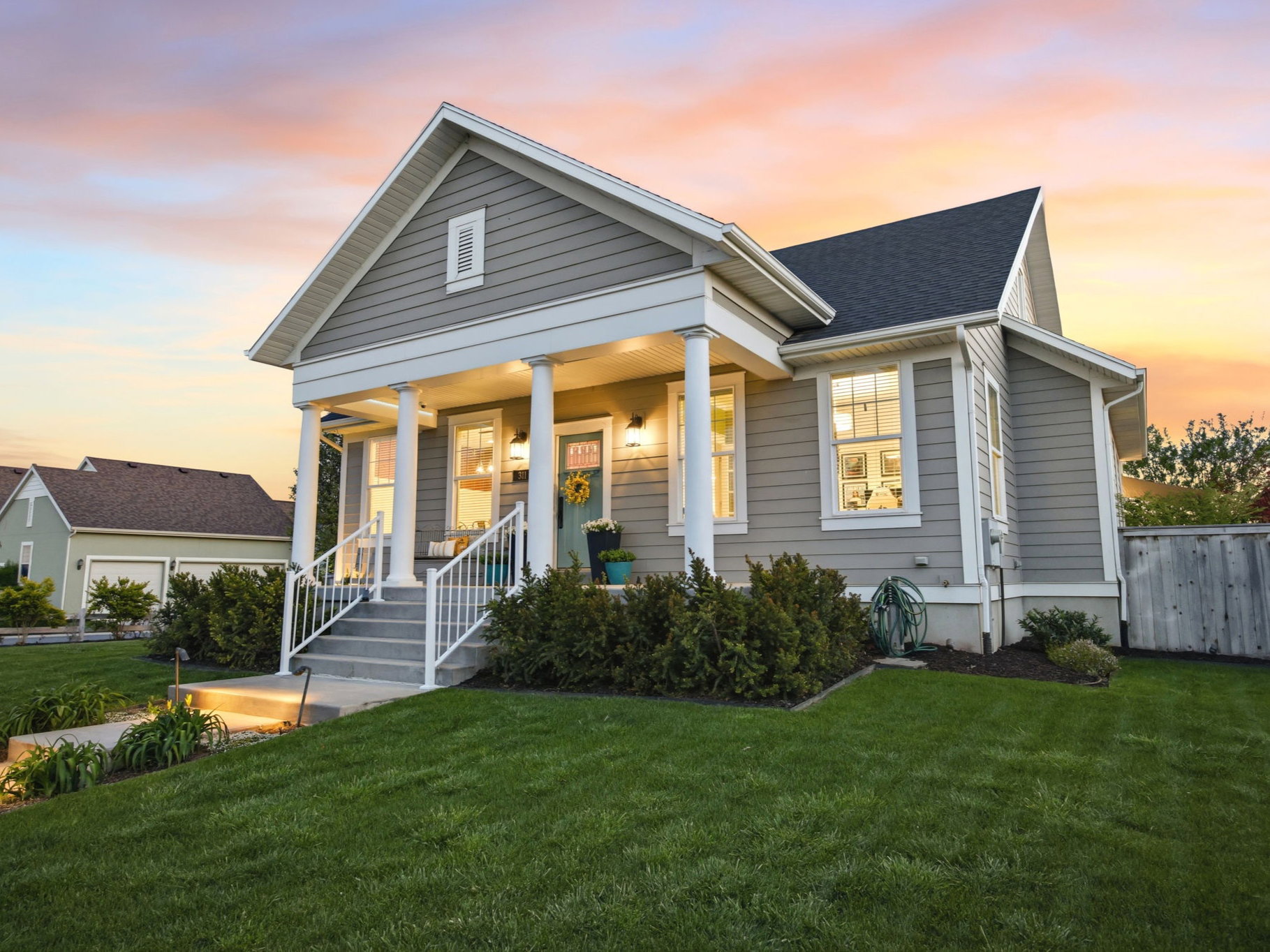 View of front of property featuring a porch and roof with shingles