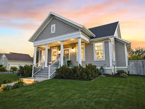 View of front of property featuring a porch and roof with shingles