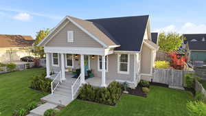 Bungalow-style home featuring a porch and roof with shingles