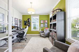 Office featuring crown molding and light wood finished floors
