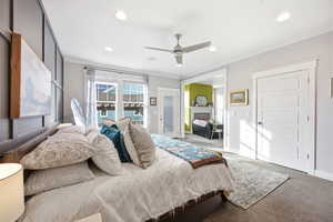 Bedroom with carpet, ceiling fan, recessed lighting, and ornamental molding