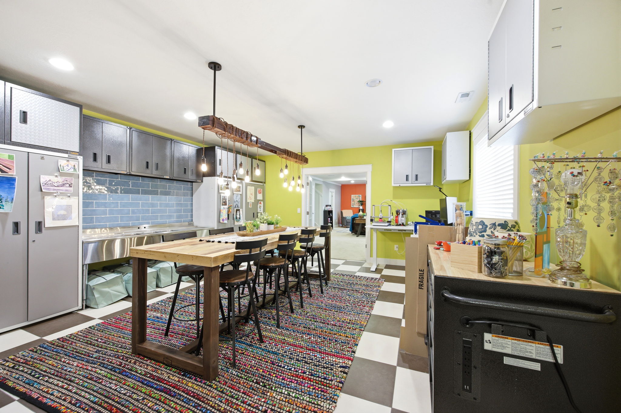 Dining area featuring dark floors and recessed lighting