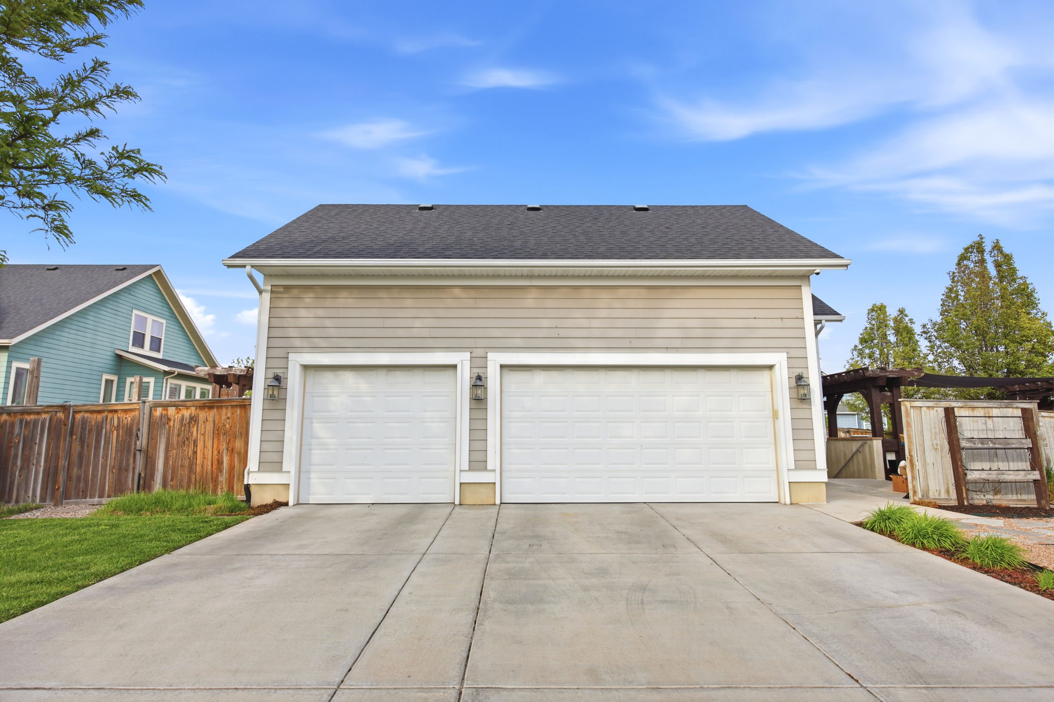 Garage with a gate and driveway