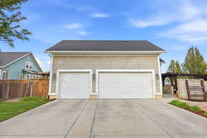 Garage with a gate and driveway