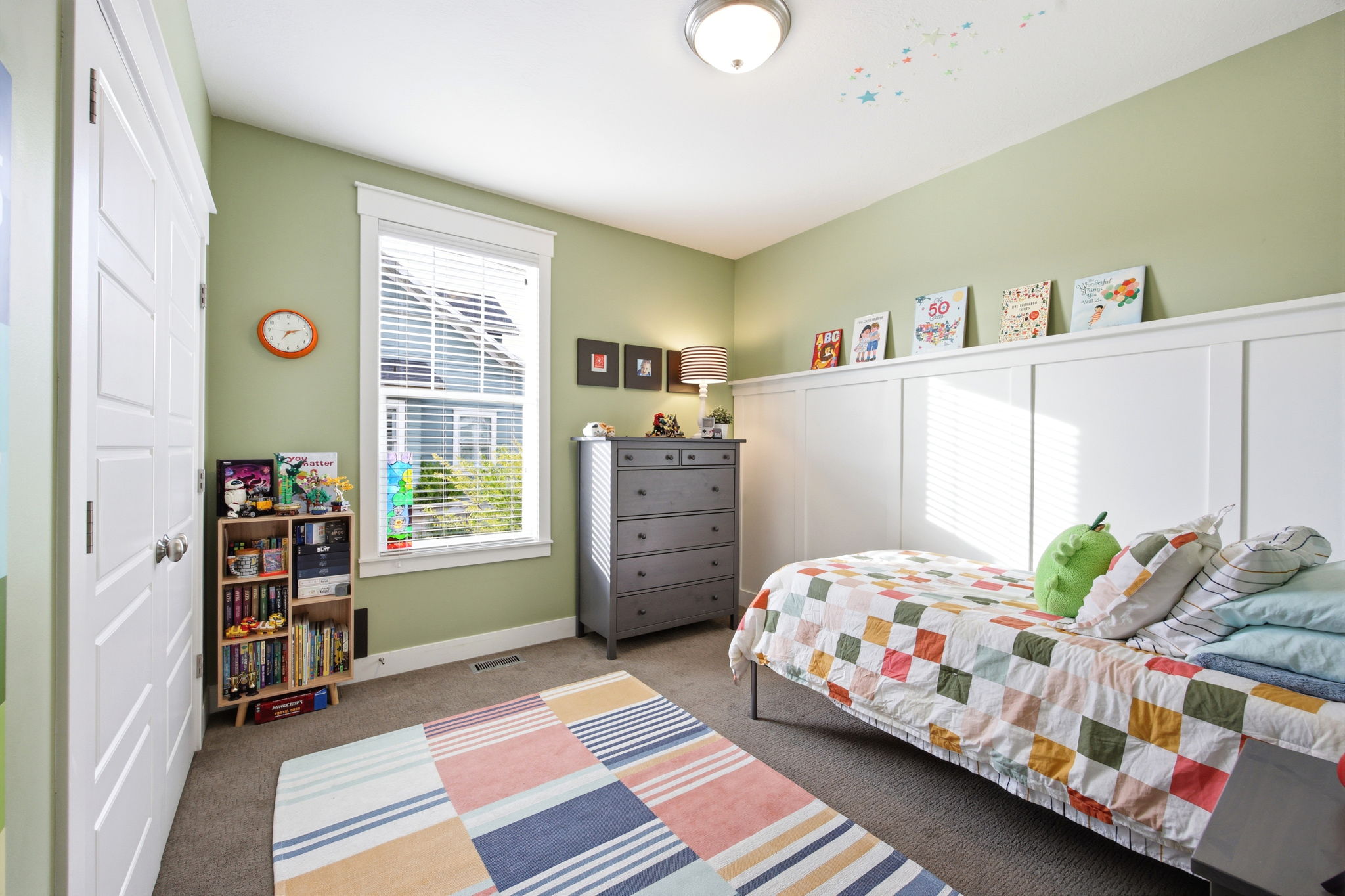 Carpeted bedroom with baseboards