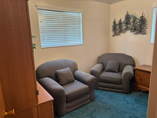 Sitting room featuring carpet flooring