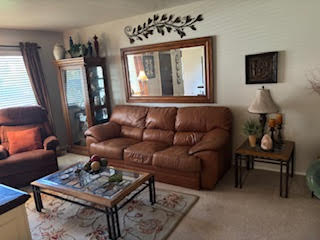 Living area with light colored carpet