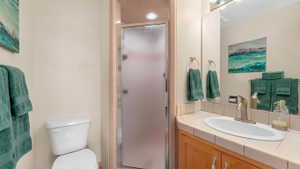 Full bathroom with a stall shower and vanity