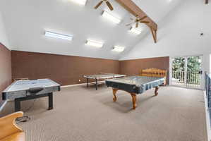 Rec room with vaulted ceiling, pool table, and a ceiling fan