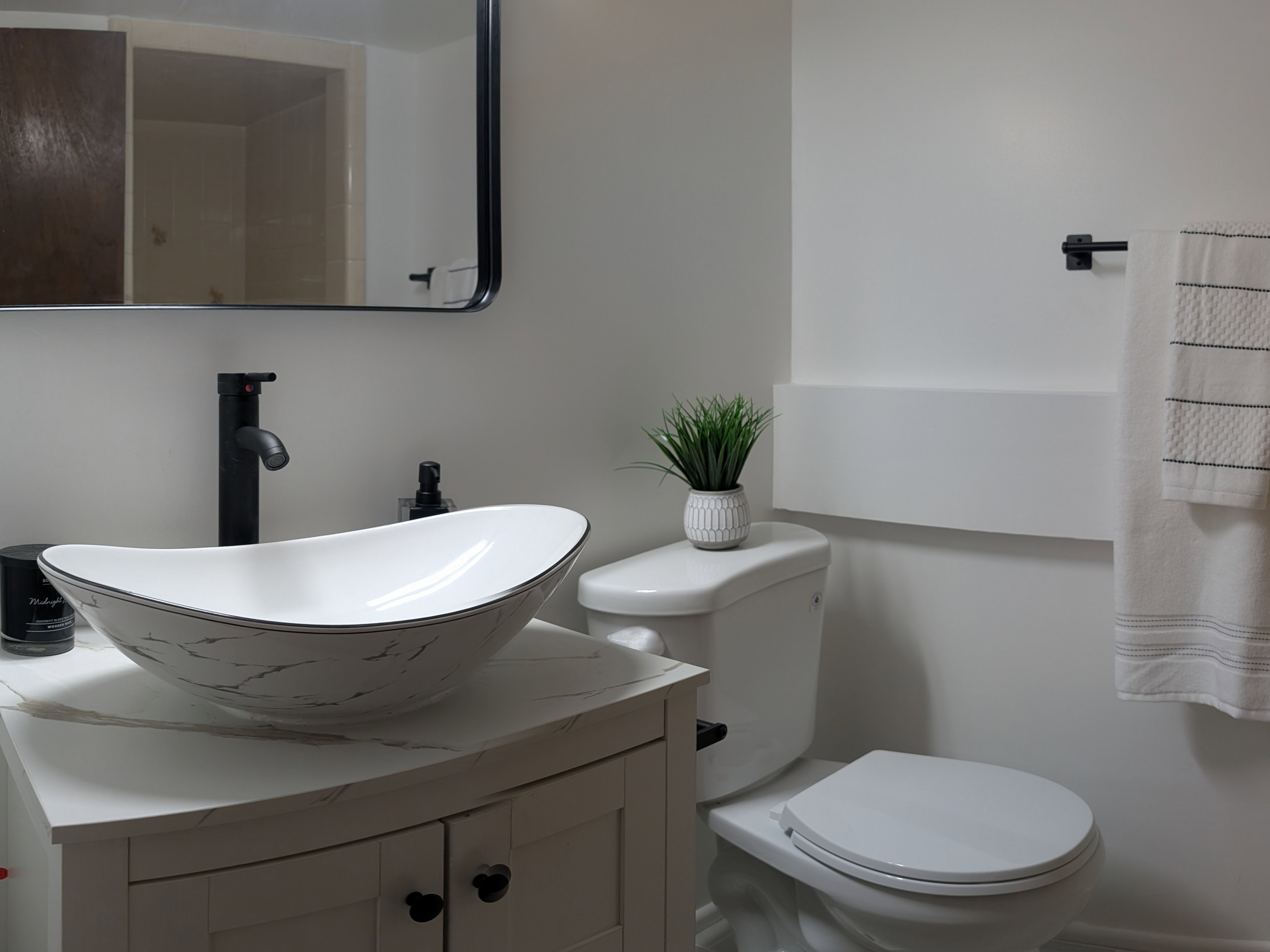 Half bath with vanity and toilet