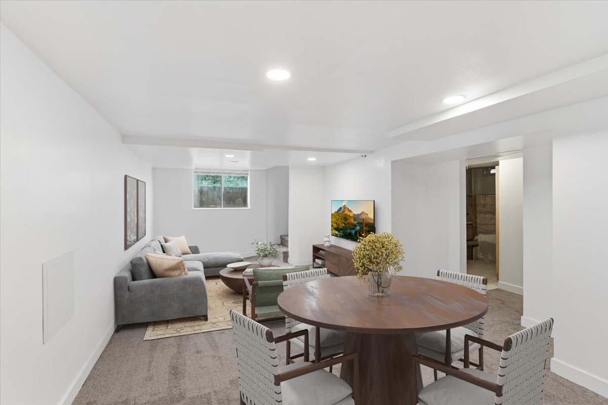 Virtually Staged-Carpeted dining space featuring baseboards and recessed lighting