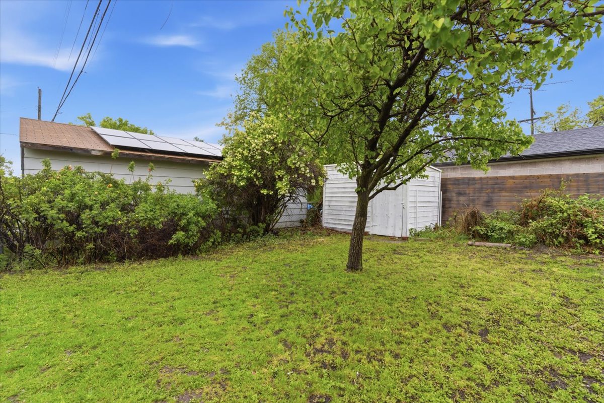 Fenced yard with a storage unit