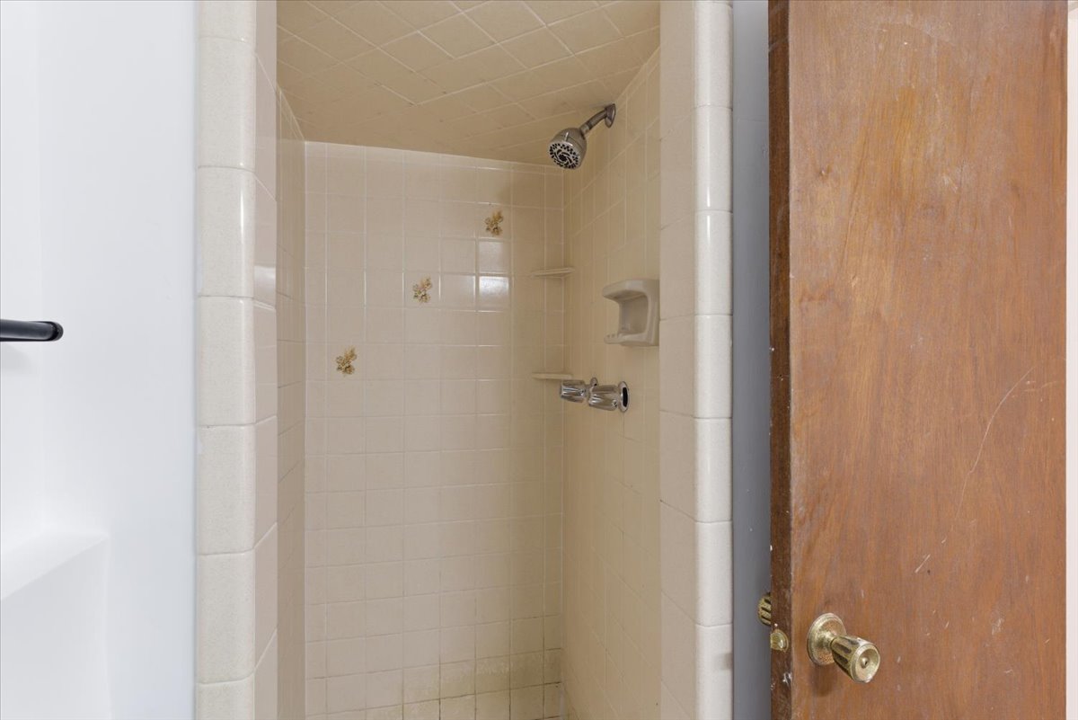 Full bathroom featuring a stall shower