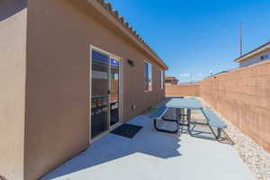 Fenced backyard featuring a patio and outdoor dining space