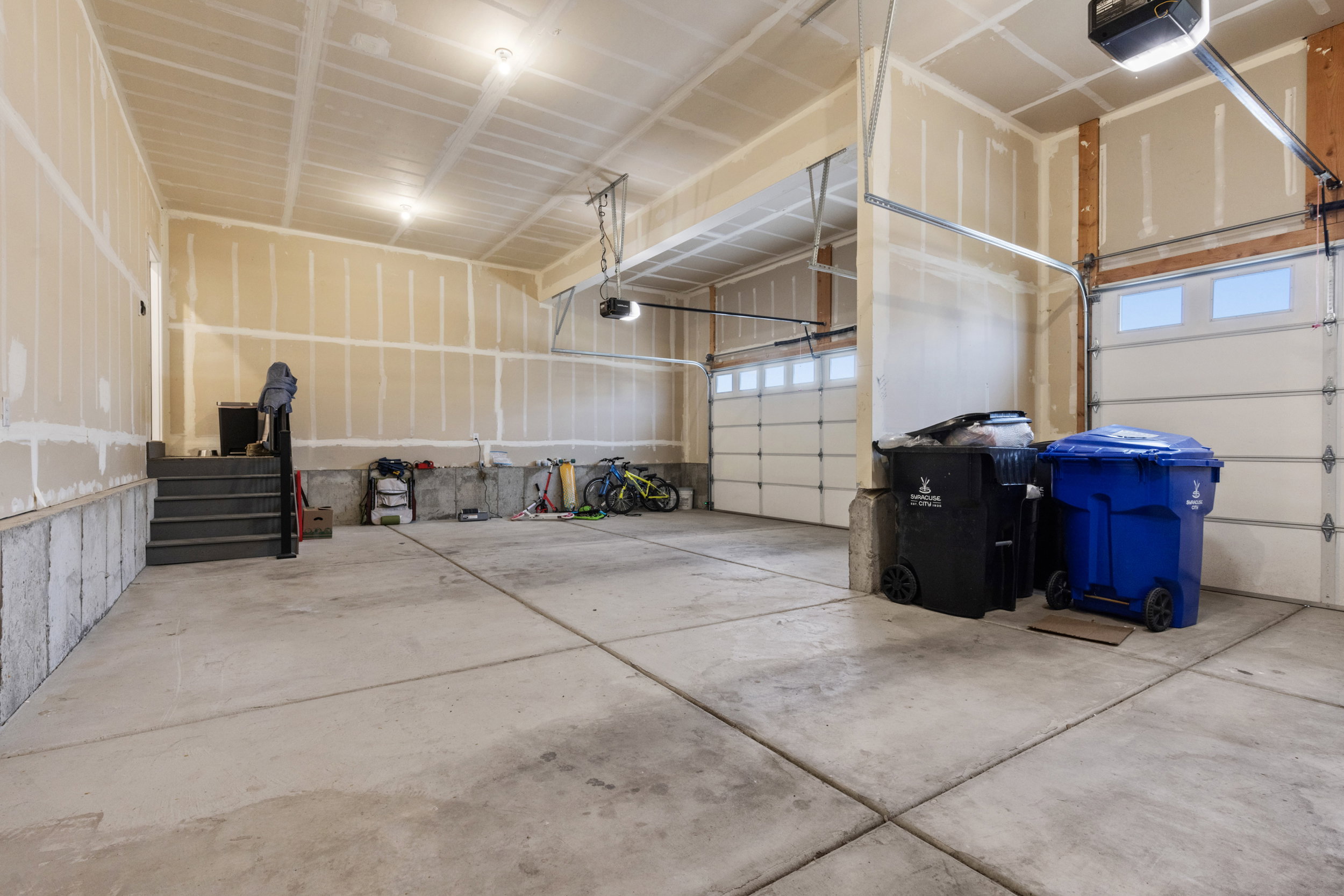 Garage featuring a garage door opener