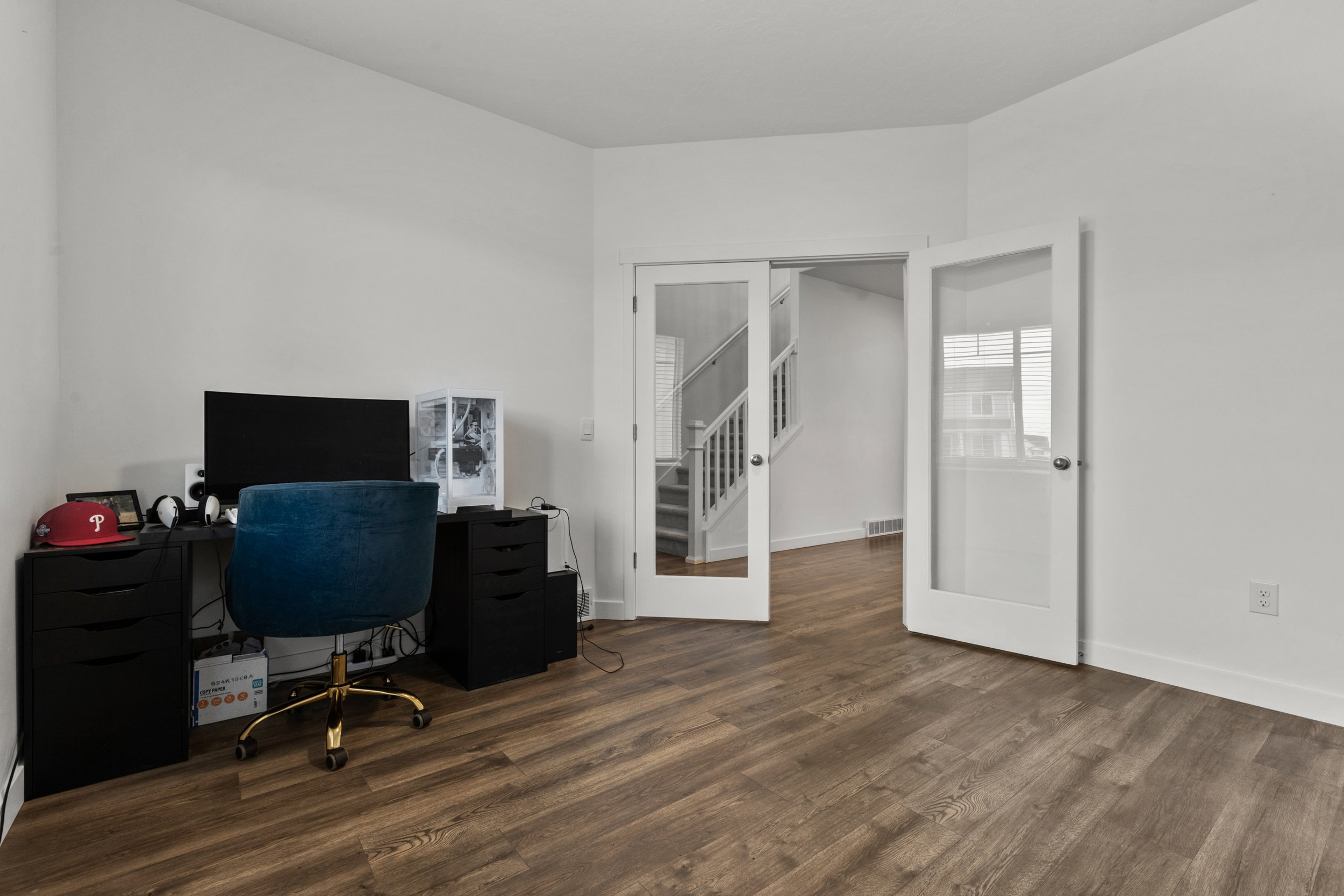Office space featuring dark wood-style floors