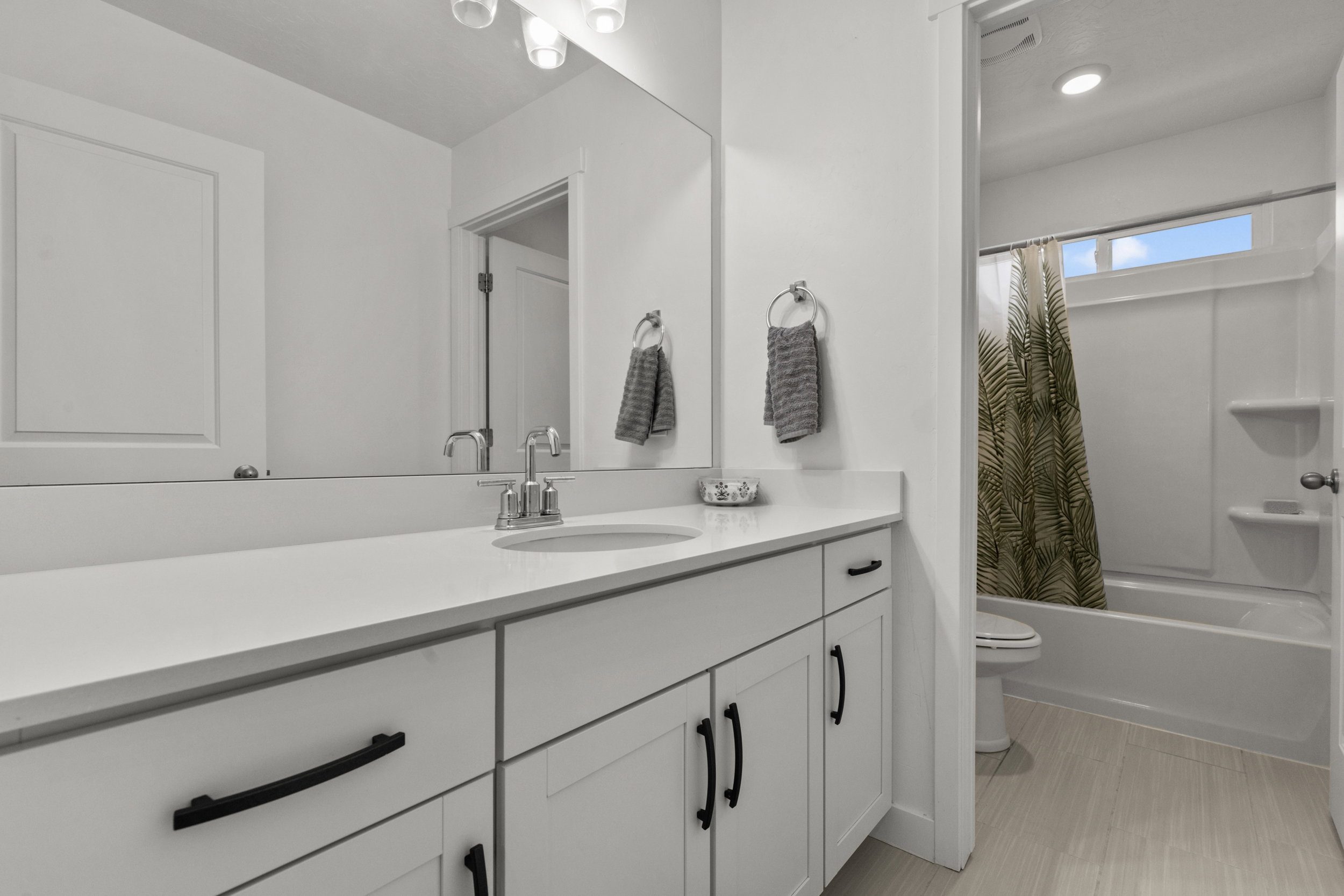 Full bathroom featuring vanity and shower / tub combo with curtain