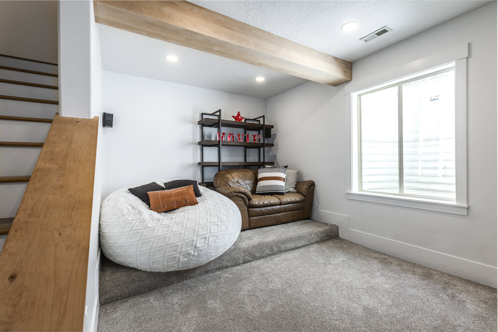 Sitting room featuring beam ceiling, carpet, and recessed lighting