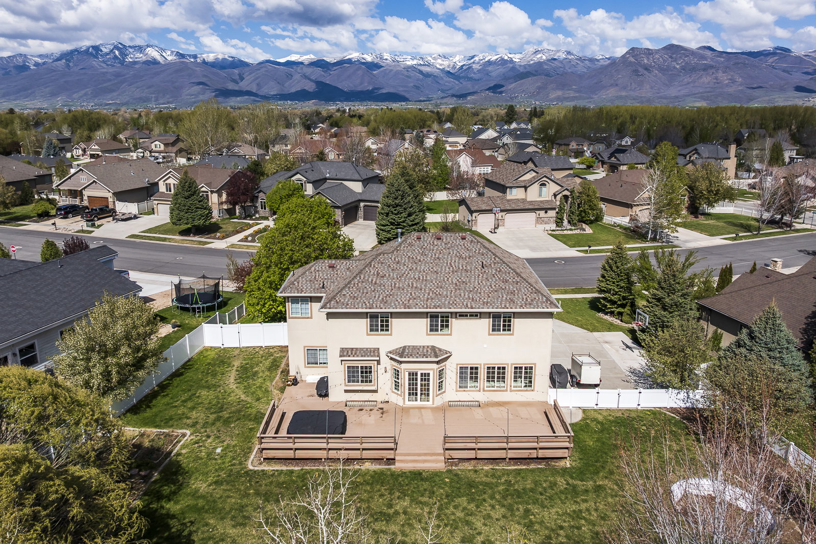 Aerial view of residential area featuring a mountainous background