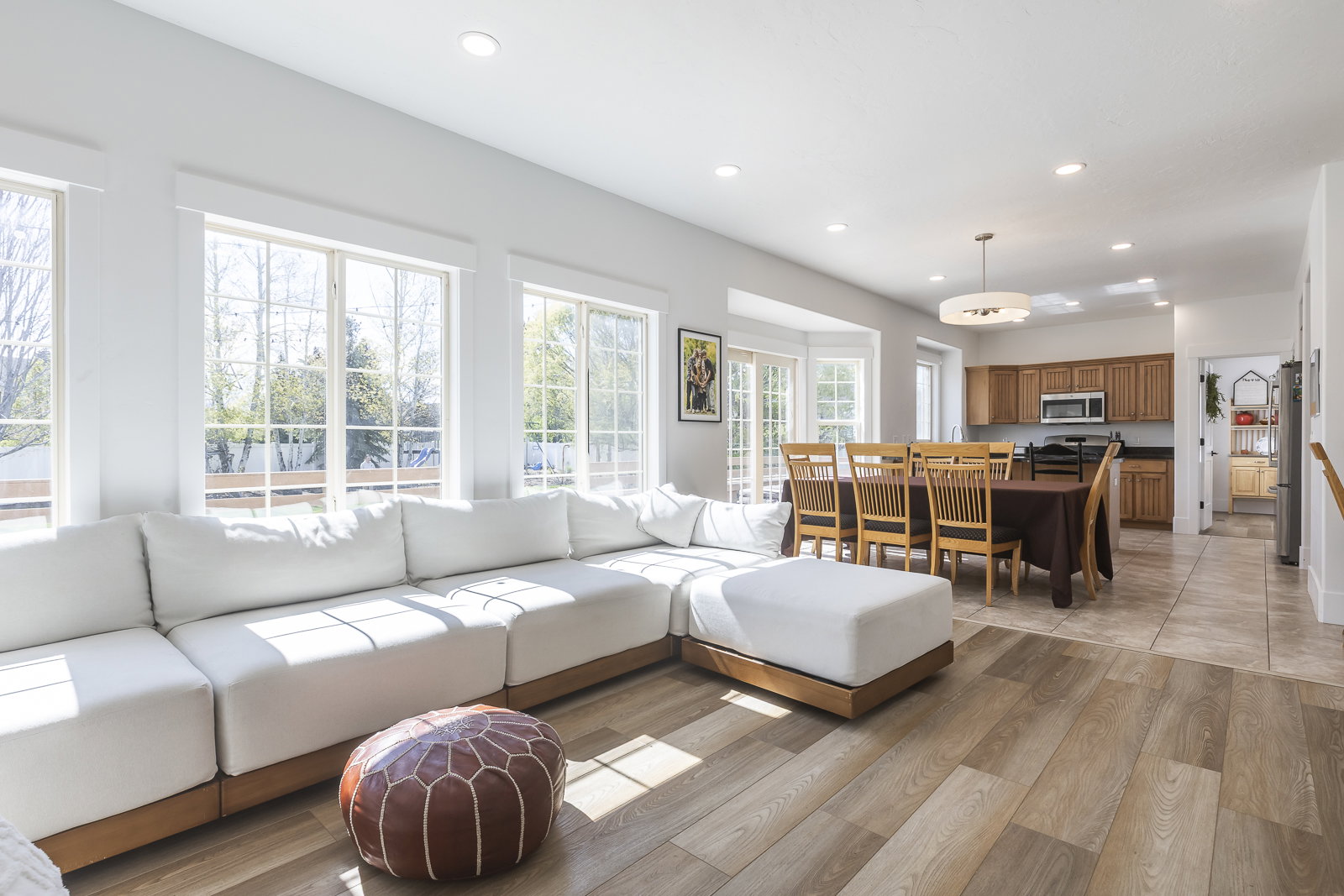 Living area featuring light wood-type flooring and recessed lighting