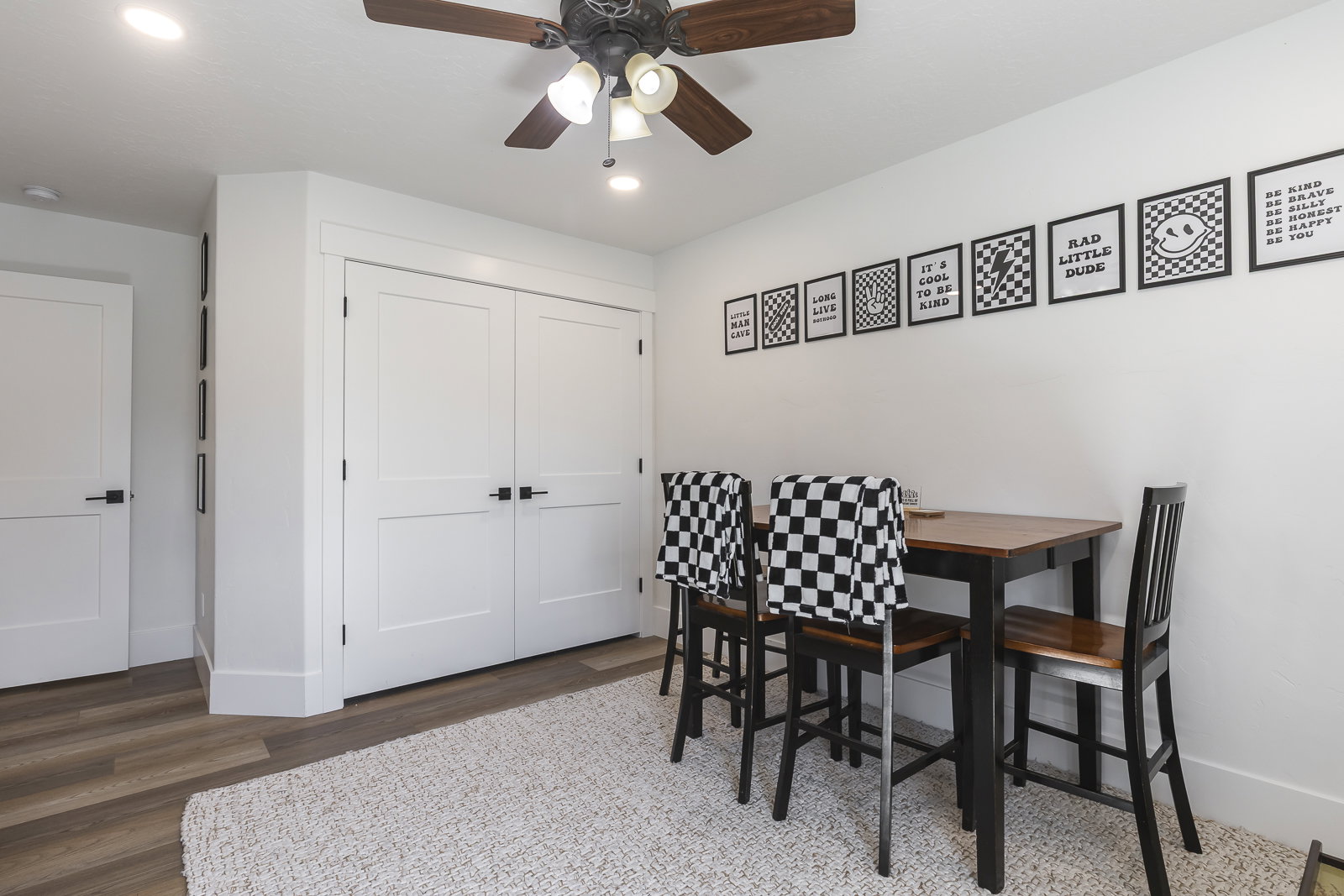 Dining space with wood finished floors, ceiling fan, and recessed lighting