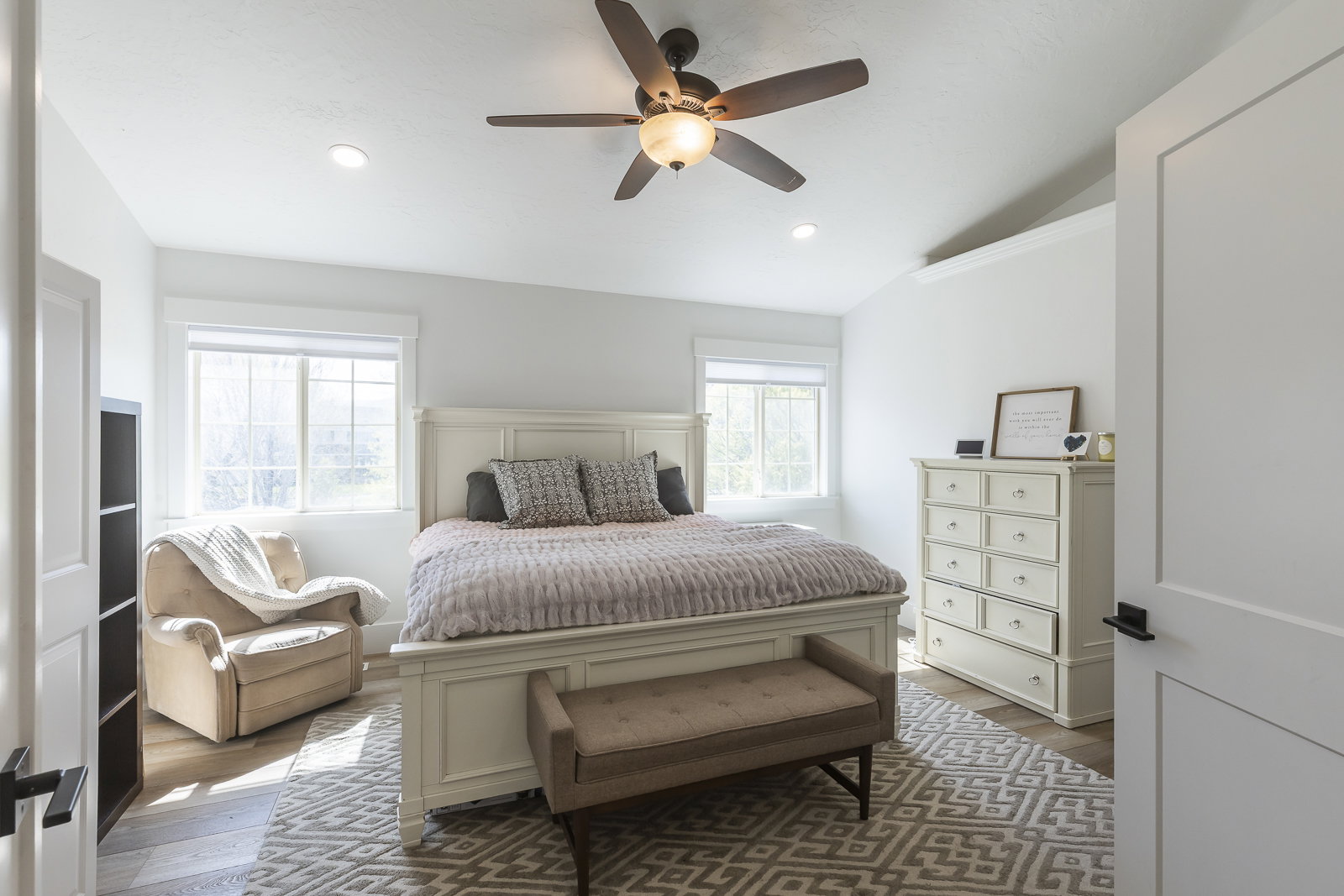 Bedroom with wood finished floors, vaulted ceiling, ceiling fan, and recessed lighting