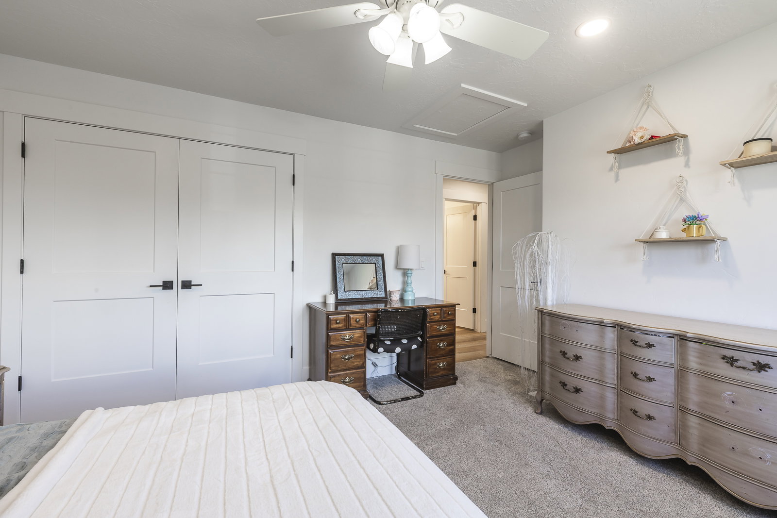 Bedroom with a closet, light carpet, ceiling fan, and recessed lighting