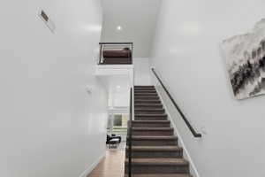 Welcome! Straight ahead to the living space or up the stairs to private and quiet bedrooms