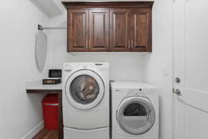 Laundry area featuring washing machine and dryer that stay with the property!
