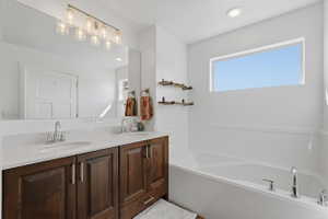Ensuite bathroom with double vanity, and get a load of that garden tub!