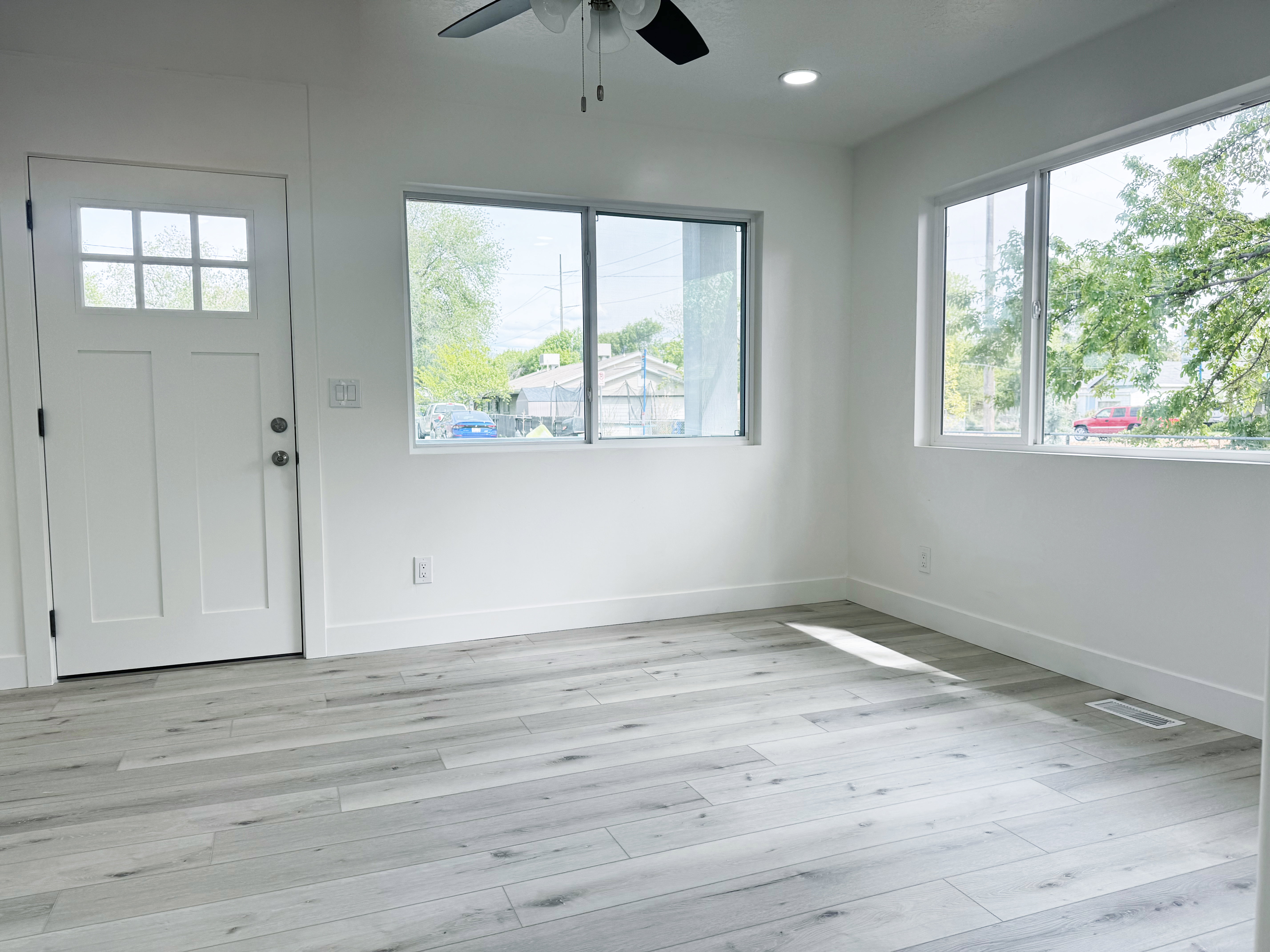 Entryway with ceiling fan, light wood finished floors, plenty of natural light, and recessed lighting