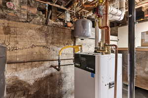 Utility room featuring new high efficiency condensing boiler