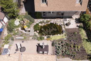 View of the backyard from the house looking at the garage