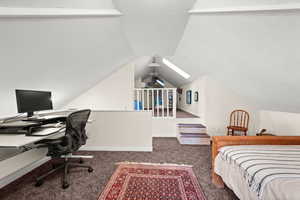 Upstairs bedroom featuring second staircase to main floor living room