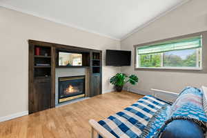 One bedroom apartment above the garage with big south facing windows, gas fireplace and built in bookshelves