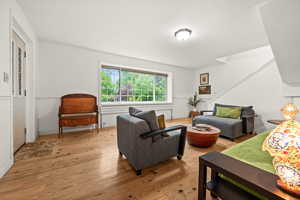 Living area with light wood finished floors and fresh paint