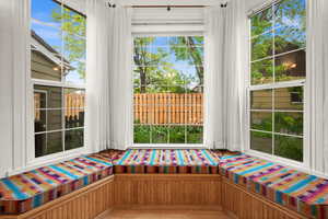 Main floor family room with large bay window and window seat