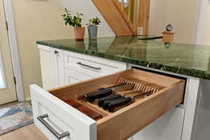 Custom kitchen cabinets, green granite counters