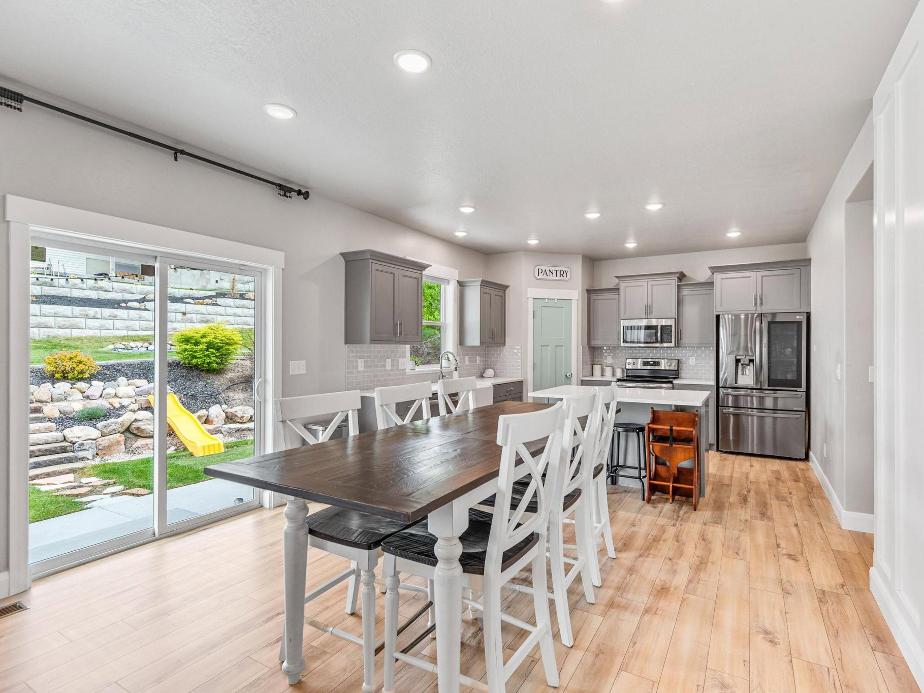 Dining area featuring light wood-style floors and recessed lighting
