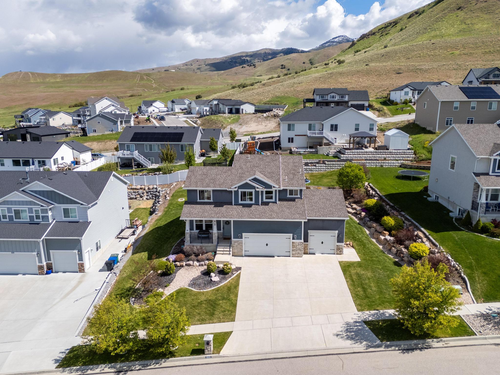 Aerial perspective of suburban area with a mountain backdrop