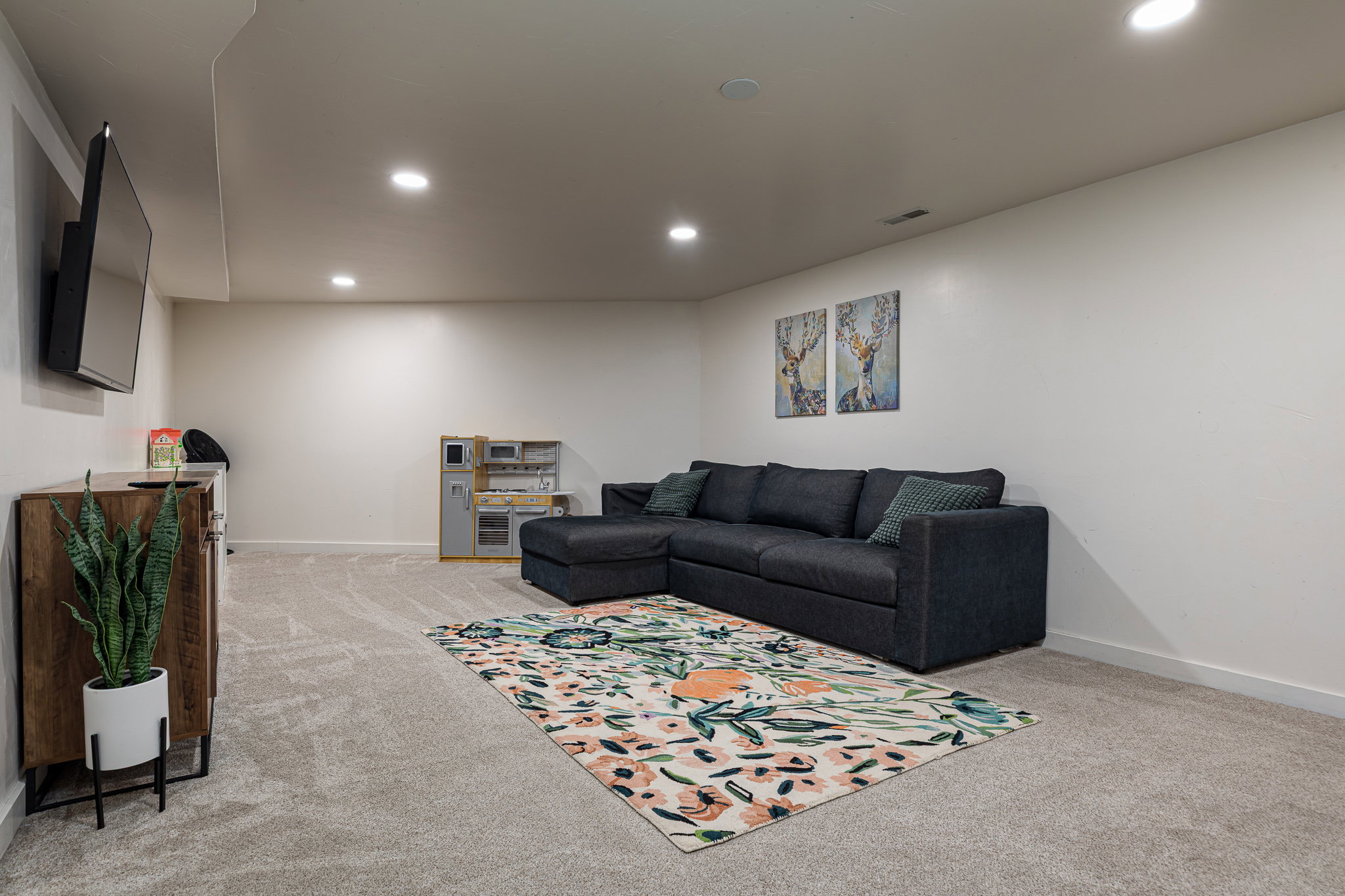 Living room featuring recessed lighting and light carpet