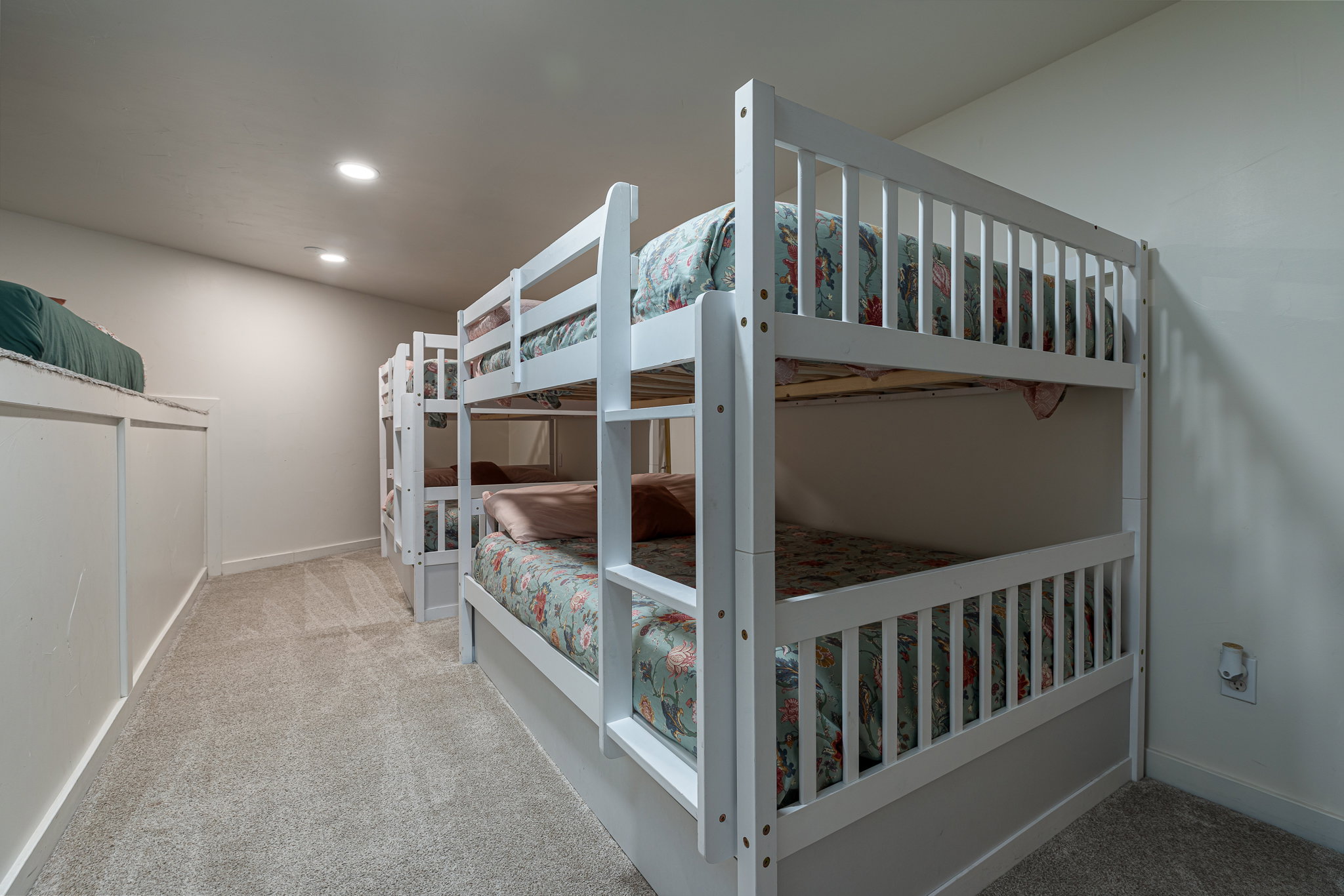 Bedroom featuring light carpet and recessed lighting