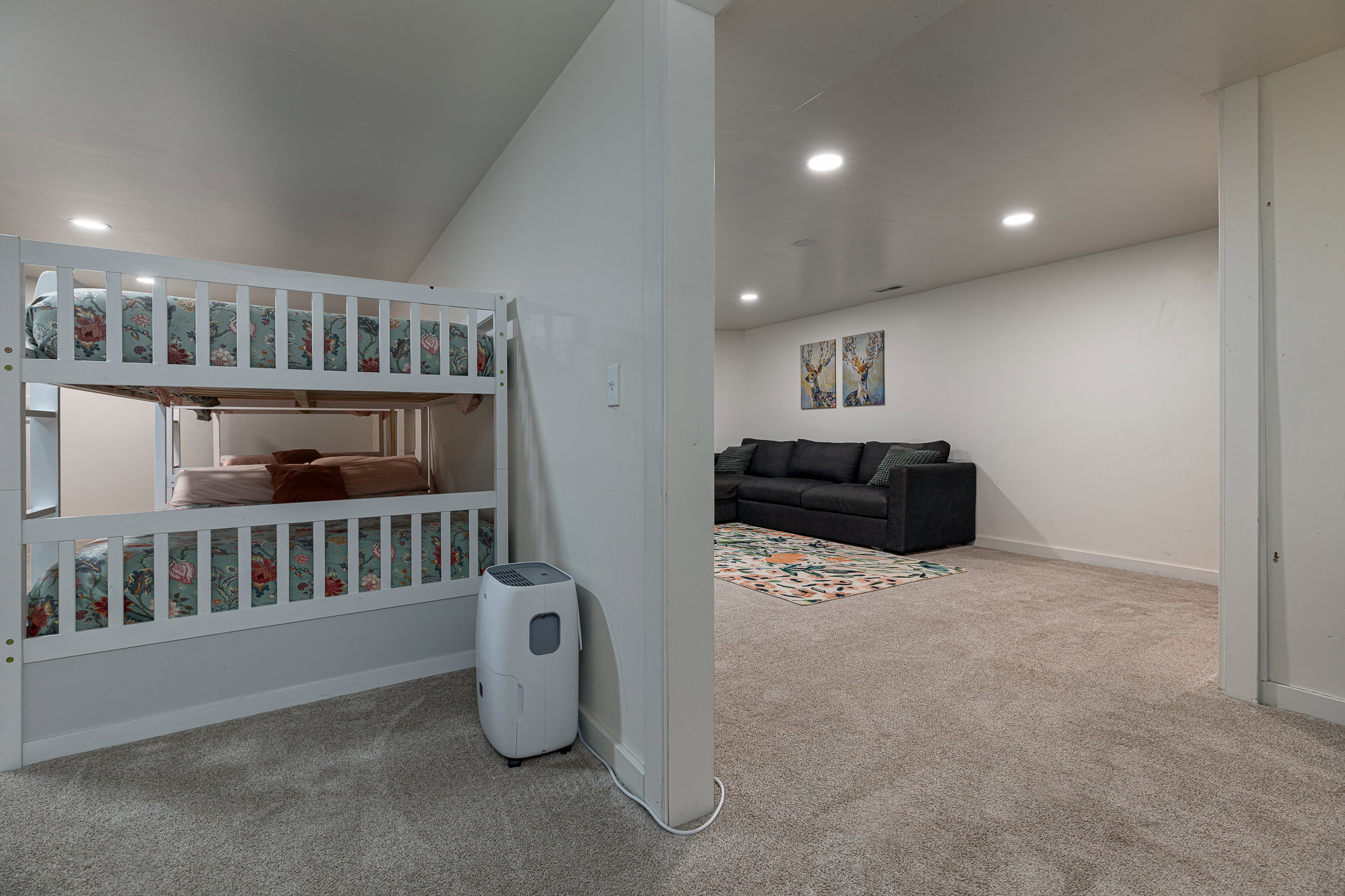 Bedroom with light carpet and recessed lighting