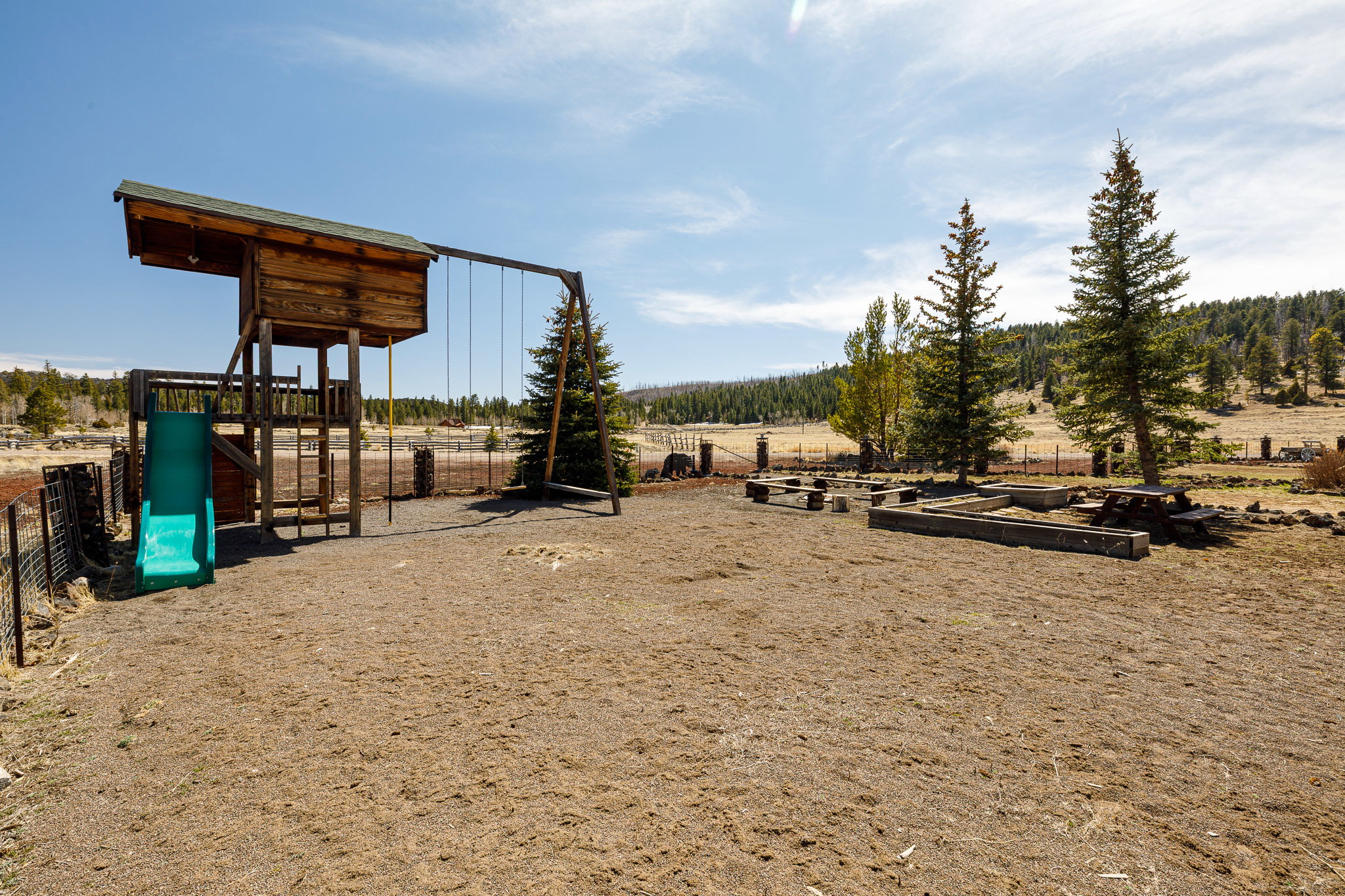 View of play area featuring a vegetable garden