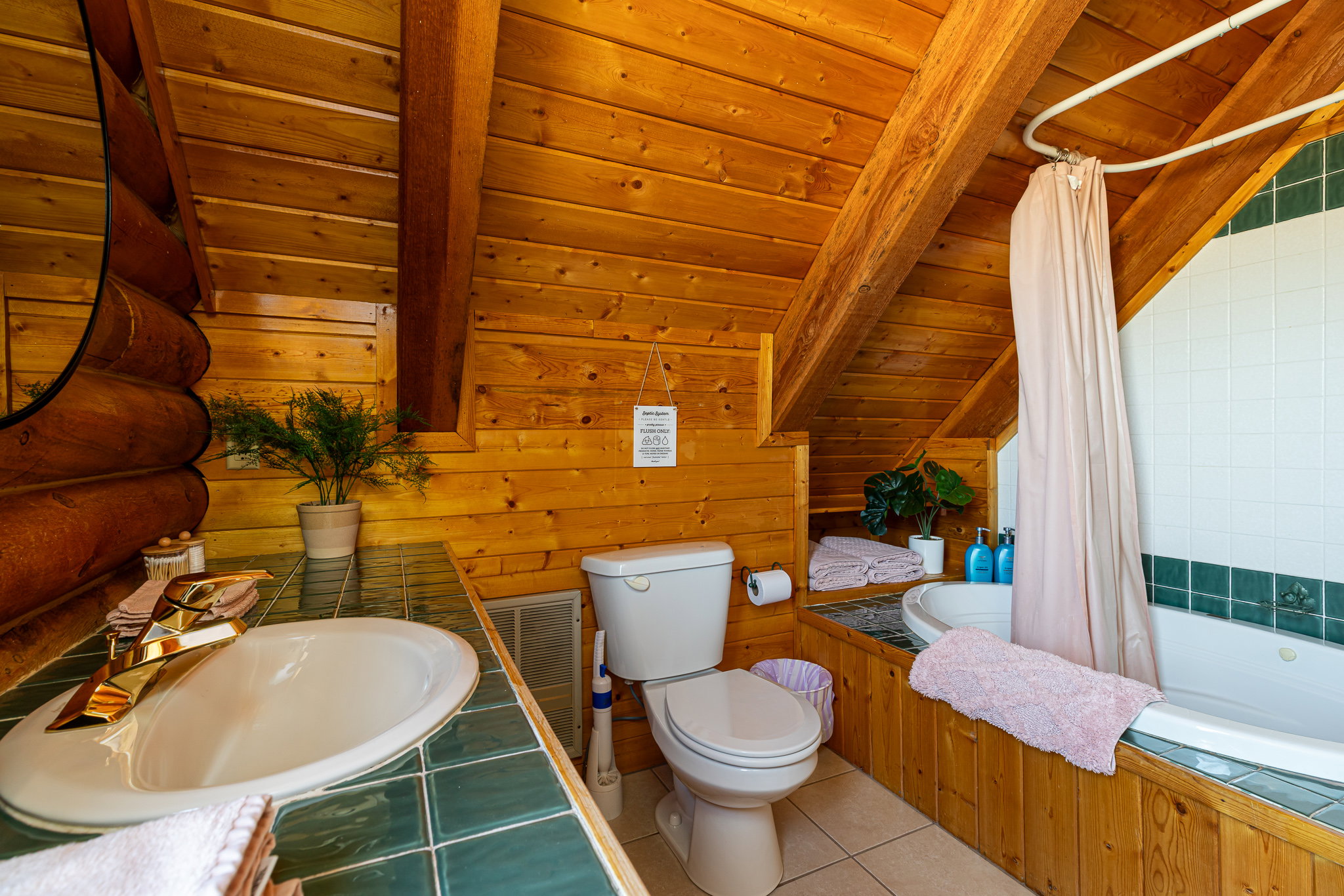 Full bath featuring tiled shower / bath combo, wood walls, tile patterned flooring, wood ceiling, and vaulted ceiling with beams