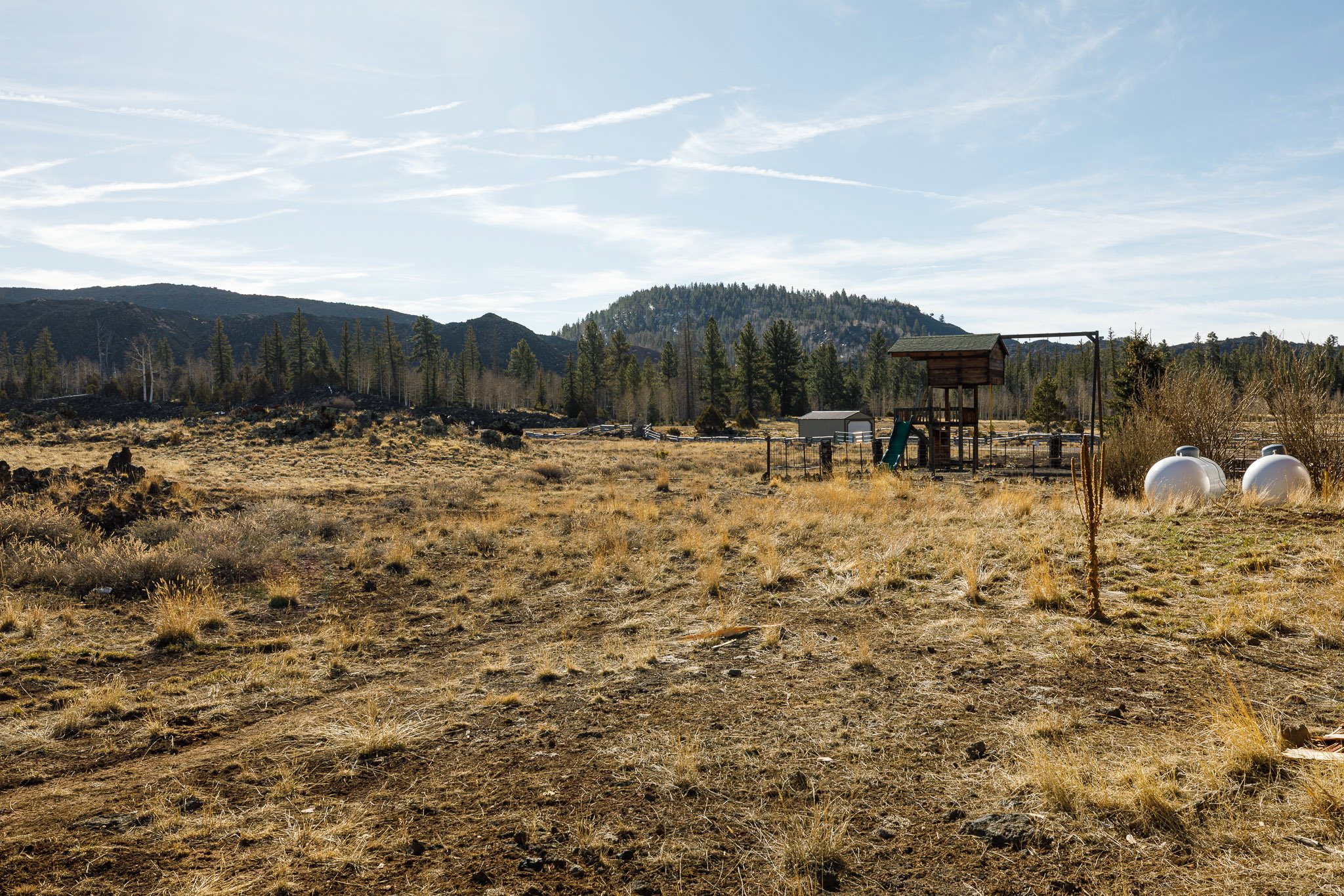View of mountain background featuring rural landscape
