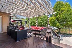 Wooden deck featuring outdoor lounge area