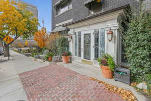 Doorway to property with brick siding