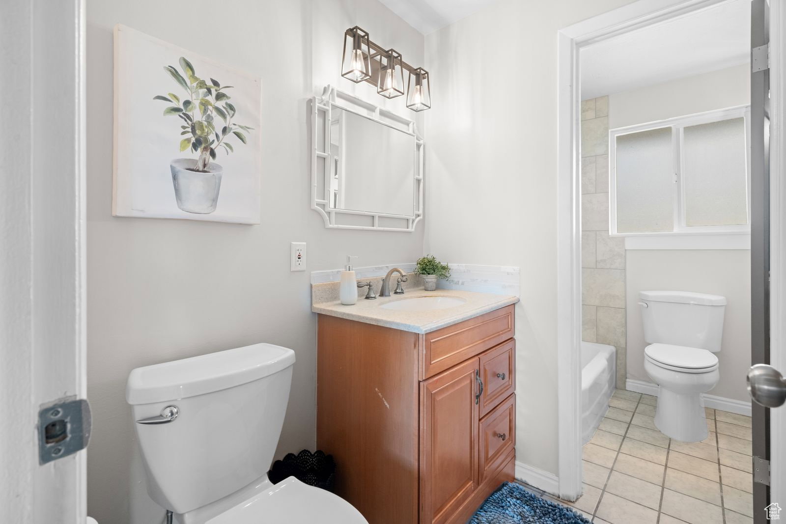 Bathroom with vanity and light tile patterned floors